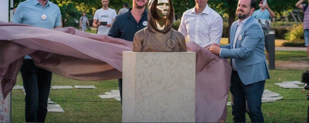 CRYPTONEWSBYTES.COM satoshi-1024x410 Two years ago, the world's first statue of Bitcoin creator Satoshi Nakamoto was officially unveiled in Budapest, Hungary  