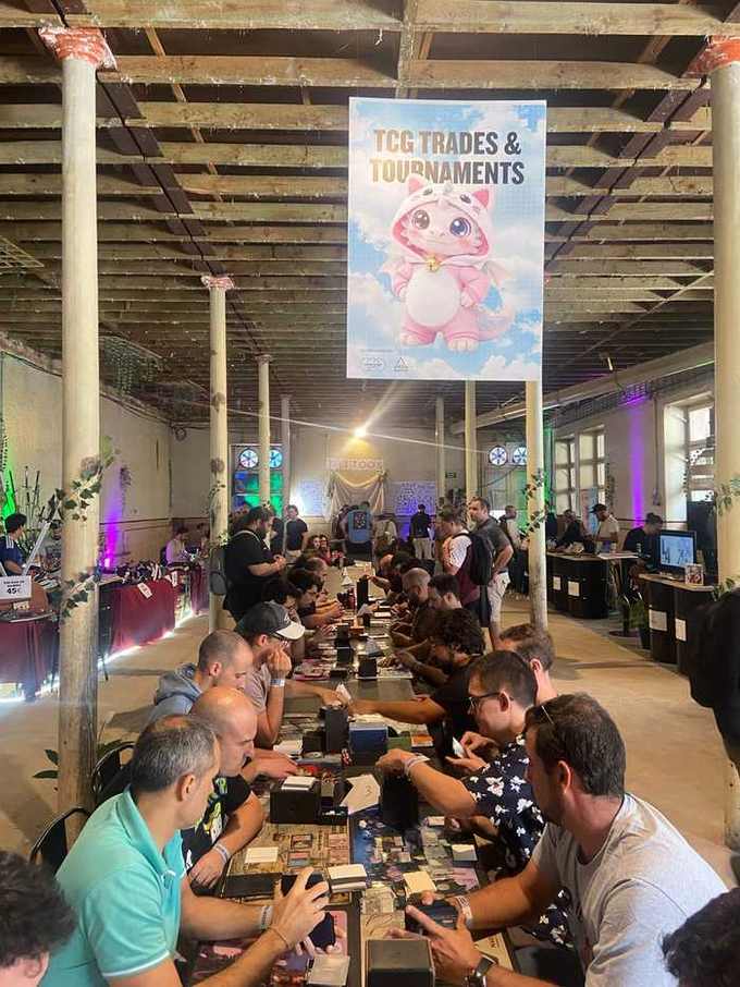 NFC Summit 2026 TCG Trades and Tournaments hall with players competing at long tables